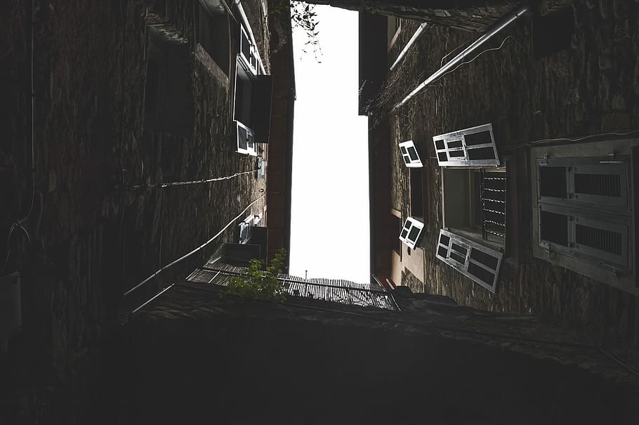 low-angle photography of brown concrete building, windows, sky HD wallpaper