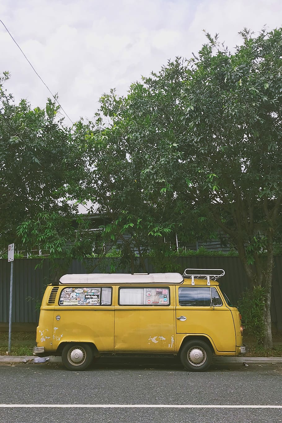 yellow van parked near trees, yellow van parked near tree during daytime