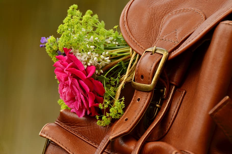 red flower, backpack, brown leather, closure, buckle, leather seam