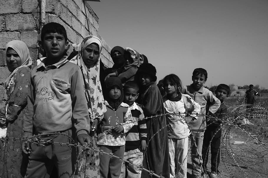 grayscale photo of toddler's, children of war, hungry, sadness