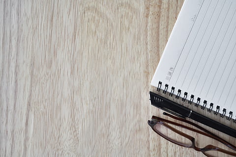 white notebook near black framed eyeglasses, pen, the work HD wallpaper