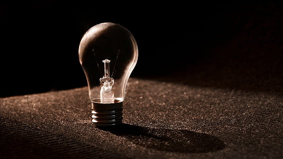 LED bulb on black surface, background, texture, lightbulb, flask HD wallpaper