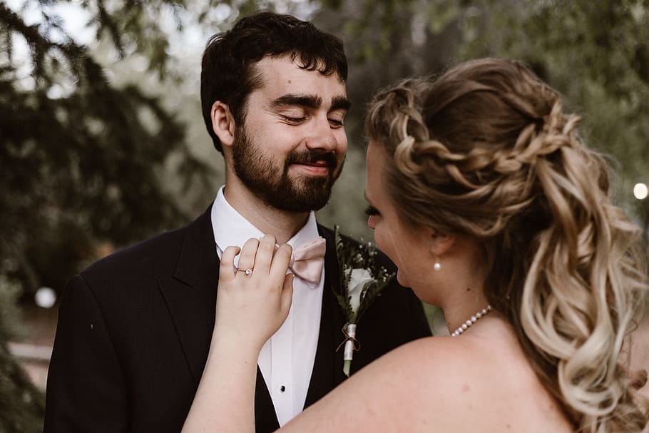 newly wed happy photo, woman fixing man's pink bow tie, selective focus, HD wallpaper