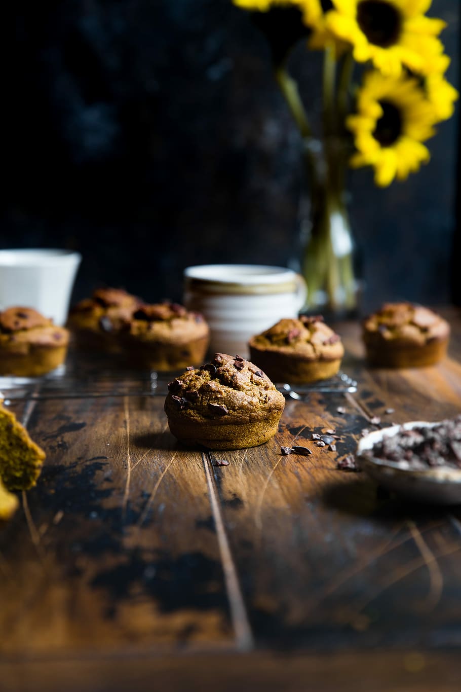 selective focus photography of muffin on top of table, chocolate cookies on table near sunflower, HD wallpaper