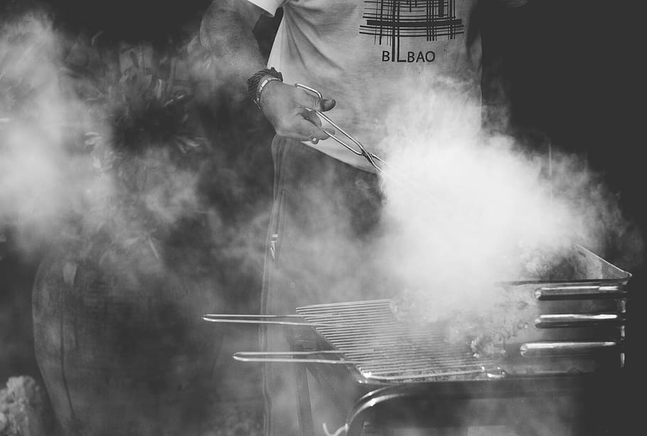 grayscale photo of man standing near gas grill, grayscale photo of person grilling meat photo, HD wallpaper