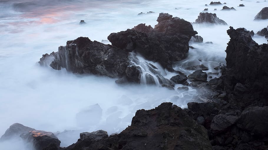 Warm Light on Rocks (II), body of water near rock formation, sunset HD wallpaper