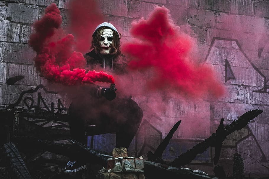 person in Joker cosplay holding smoke grenade, The Joker holding smoke grenade, HD wallpaper