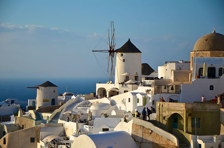 white and brown concrete houses and buildings under blue sky HD wallpaper