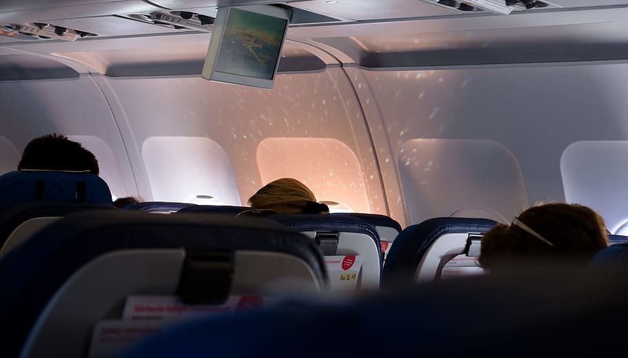 person sitting airplane seat, opened airplane window, white, projection
