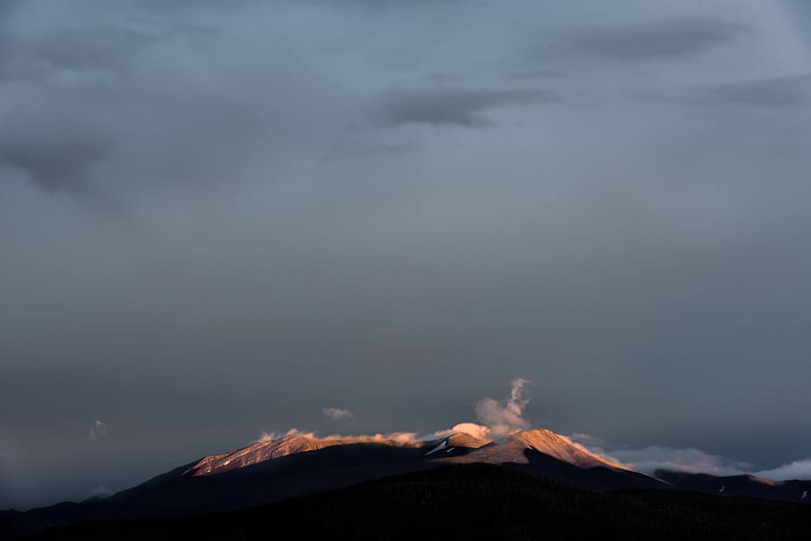 brown mountain under gray sky during daytime photography, volcano eruption during dark hour HD wallpaper