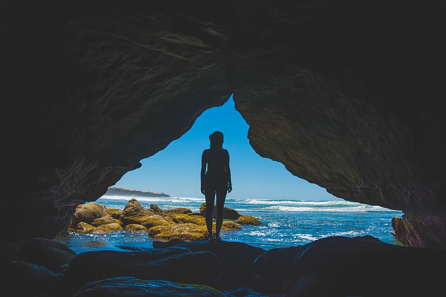 silhouette of woman standing on rock beside ocean, men, hiking HD wallpaper