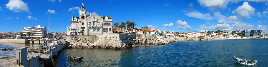 white canoe boat on body of water, cascais portugal, panorama