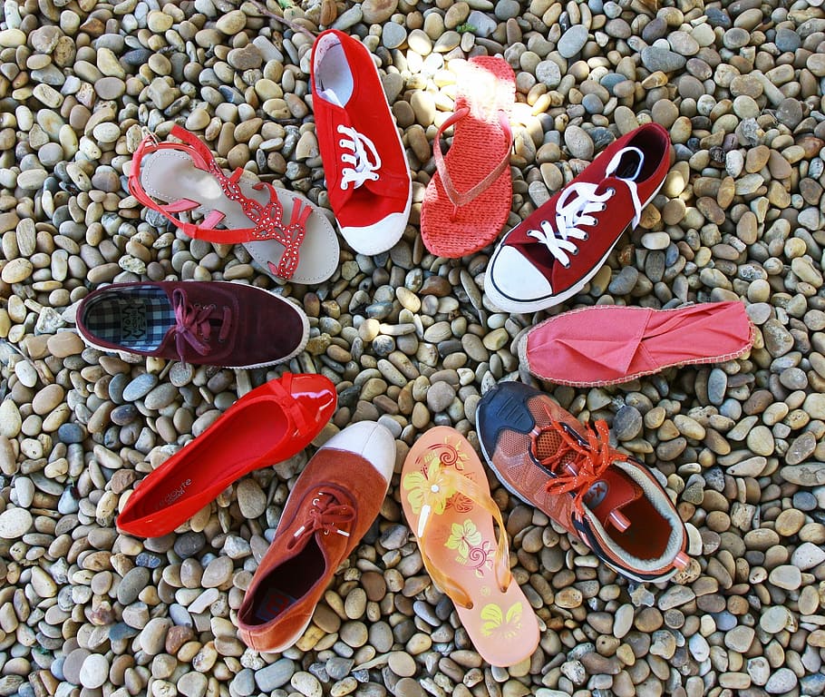 assorted pairs of footwear on pebble stones, circle, shoes, red tones, HD wallpaper