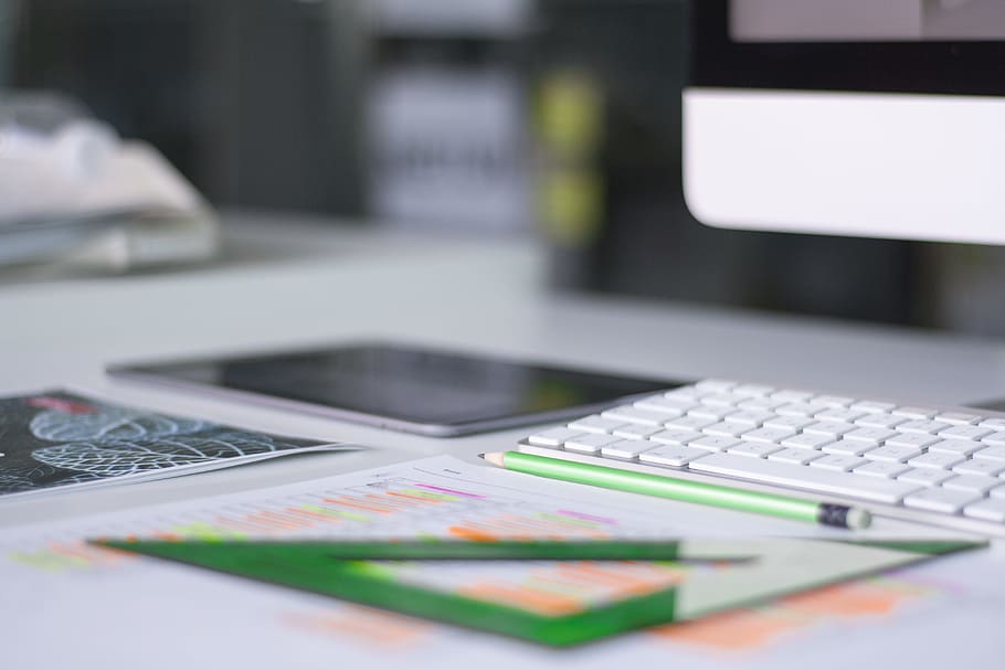silver iMac near Magic Keyboard and green measuring tool, teal pencil near black iPad and iMac HD wallpaper