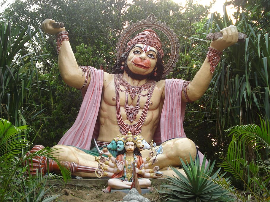 Lord Hanuman statue and statuette placed on ground, hindu god