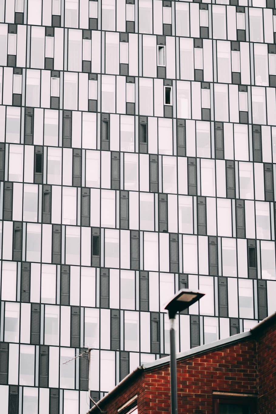 low angle photo of white and black high-rise building, white and grey concrete building HD wallpaper