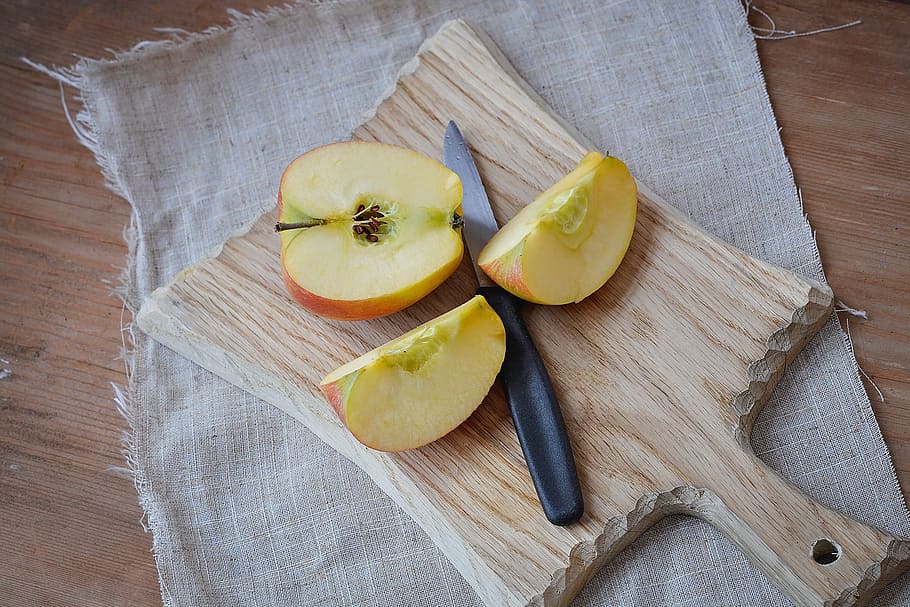 sliced apple fruit on brown chopping board, bio apple, cut HD wallpaper