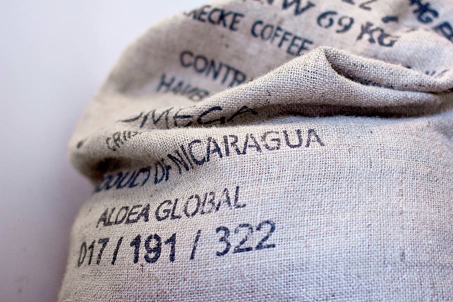 white and black sack bag, aldea, global, burlap, coffee, beans