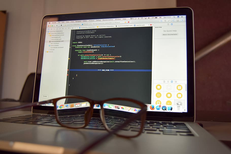 eyeglasses on turned on laptop, closeup photo of black MacBook Pro HD wallpaper