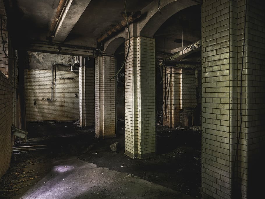 empty gray concrete hallway, lost place, horror, abandoned building