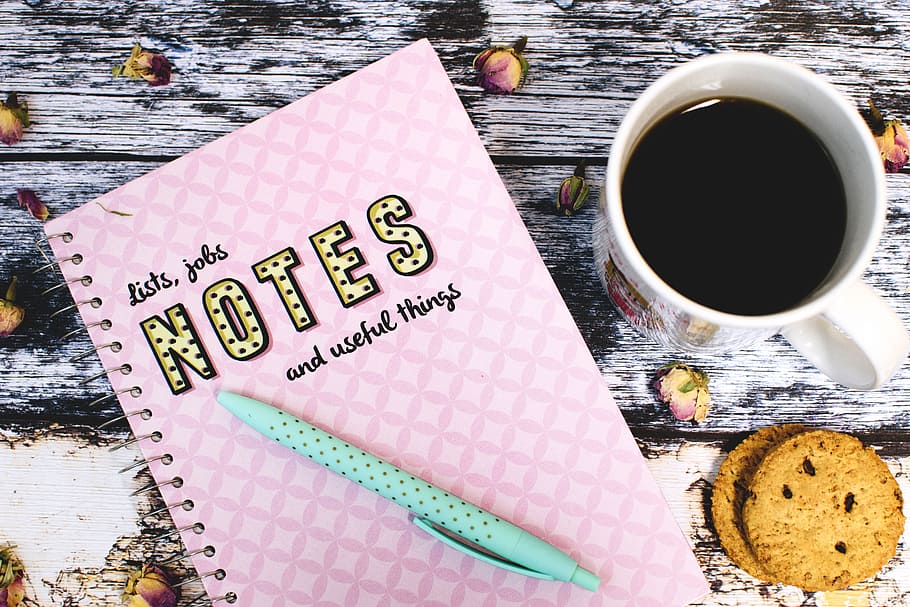 pink Notes with teal click pen next to white ceramic mug with coffee HD wallpaper