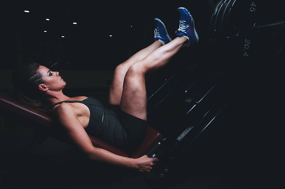 woman doing leg work in gym, black, spaghetti, strap, tank, top