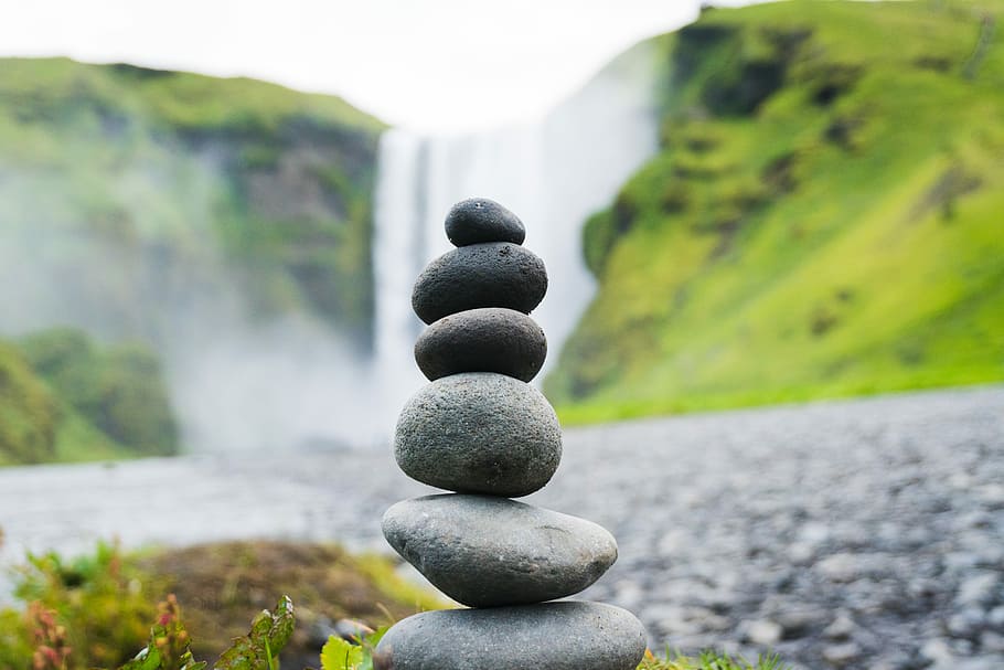 cairn stone in Skogafoss Falls, Iceland, gray stone near waterfall at daytime, HD wallpaper