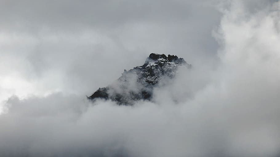 Snowy mountain summer peeks through clouds in Franz Josef Glacier, mountain surrounded fogs HD wallpaper
