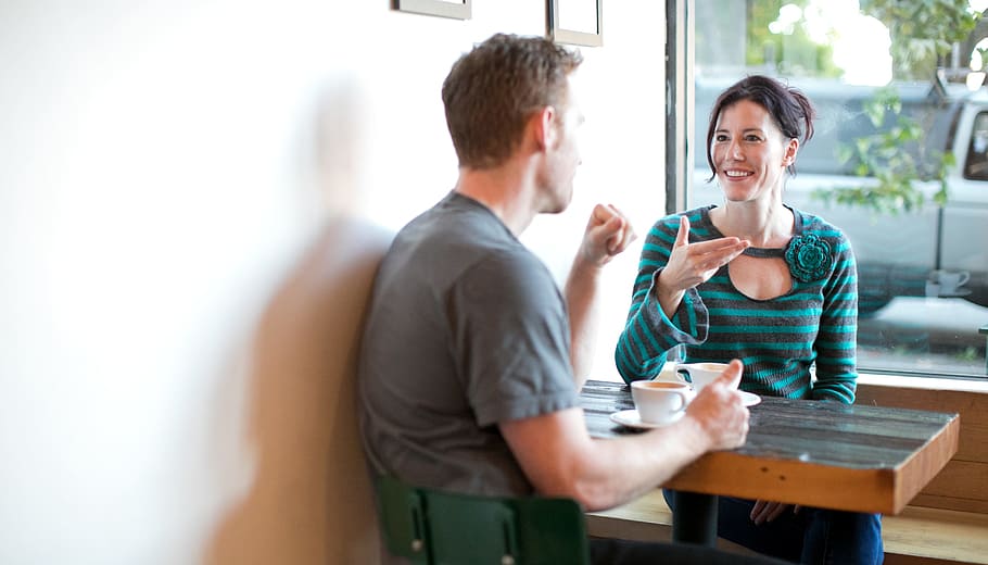 male and female talking to each other, woman, date, coffee, love