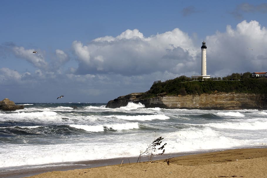 Lighthouse, Sea, Waves, beach, water, day, sky, land, guidance HD wallpaper