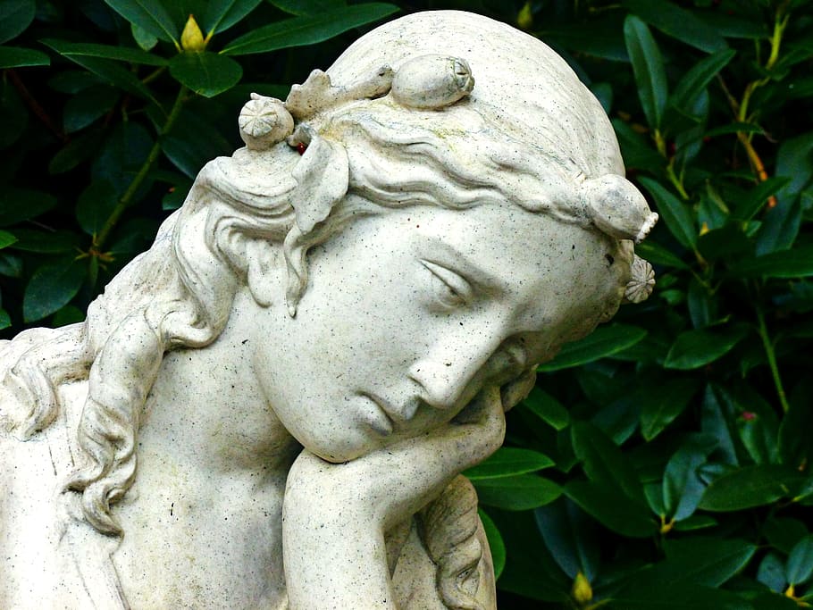 female statue near leafed plants, angel, woman, head, face, figure
