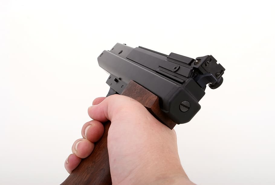 person's hand holding semi-automatic pistol, gun, 38, action
