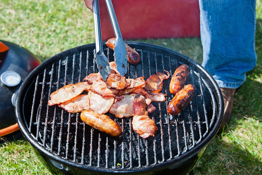 person grilling sausage, bbq, camping, barbecue, food, cooking HD wallpaper