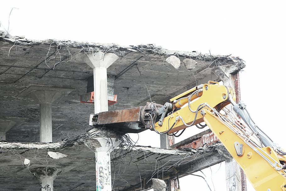 wrecked building with yellow heavy equipment at daytime, black HD wallpaper