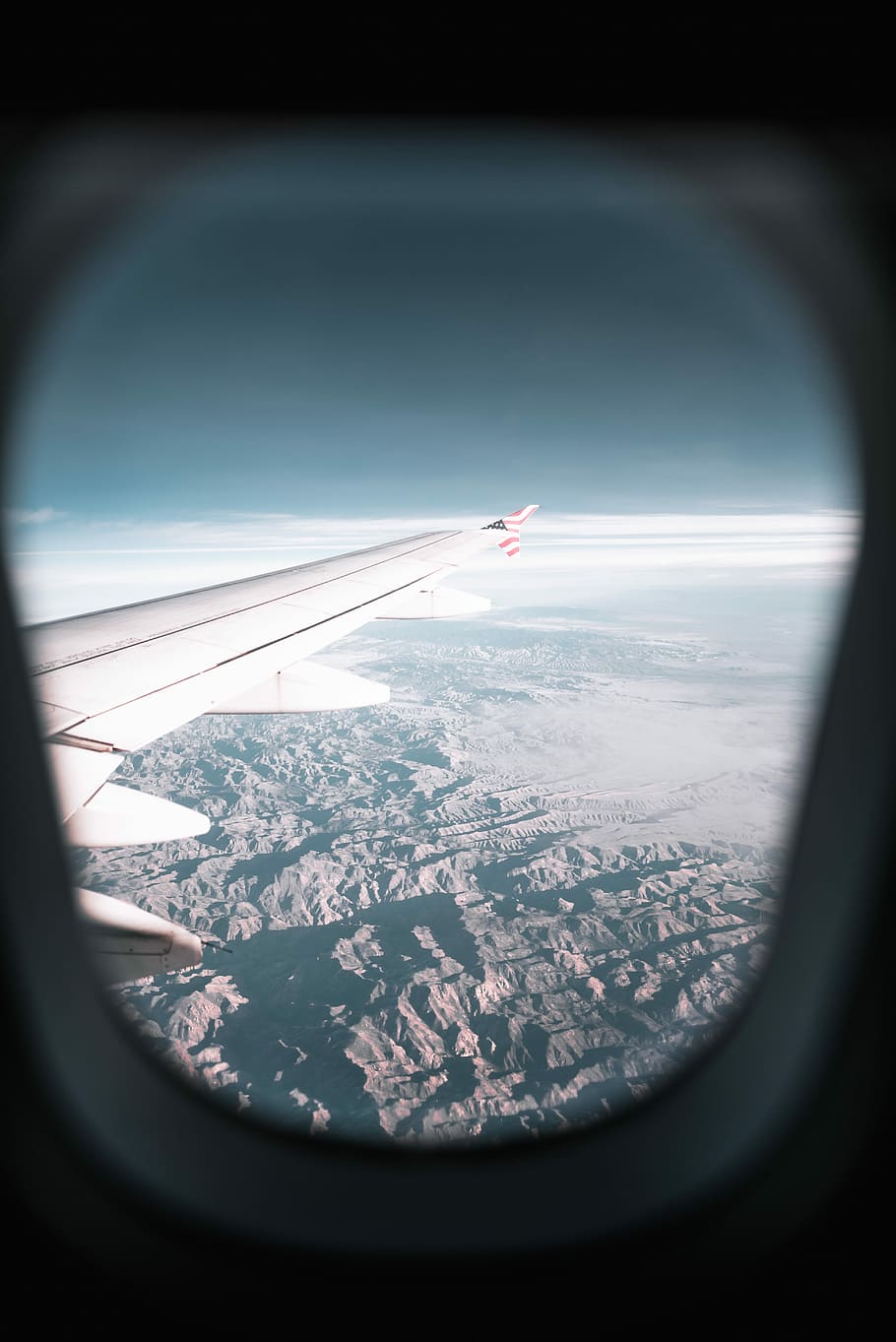 HD wallpaper: airplane window view of airplane's wing and mountains during  day, plane-window photography of mountain and cloud | Wallpaper Flare