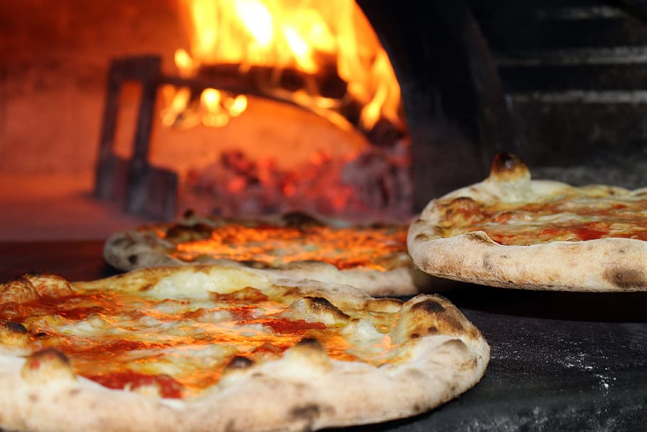 baked pizza in wood fired oven, pizzeria, food, alimentari, restaurant