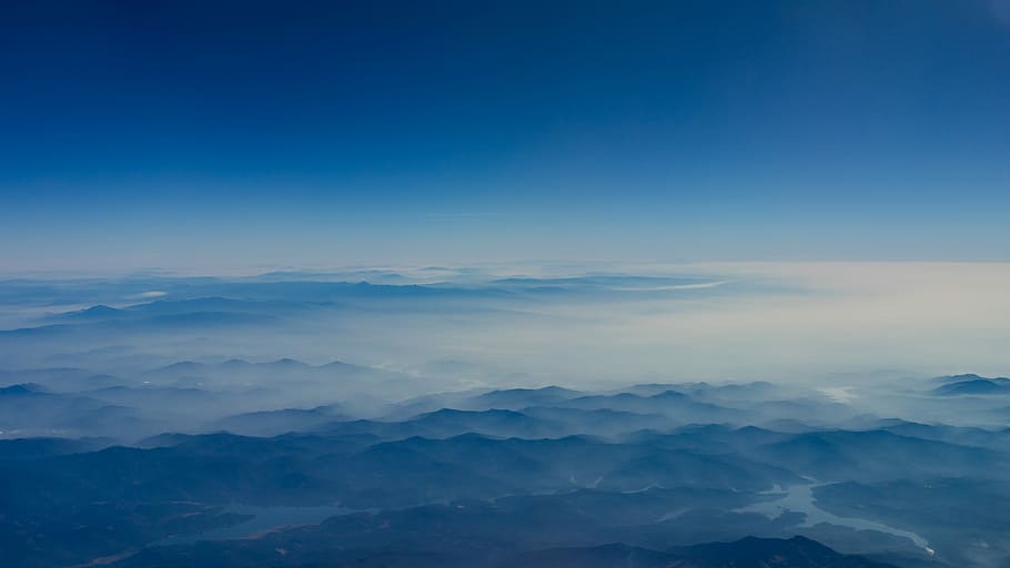 bird's eye view photography of moutain, aerial view photography of mountain under blue sky HD wallpaper