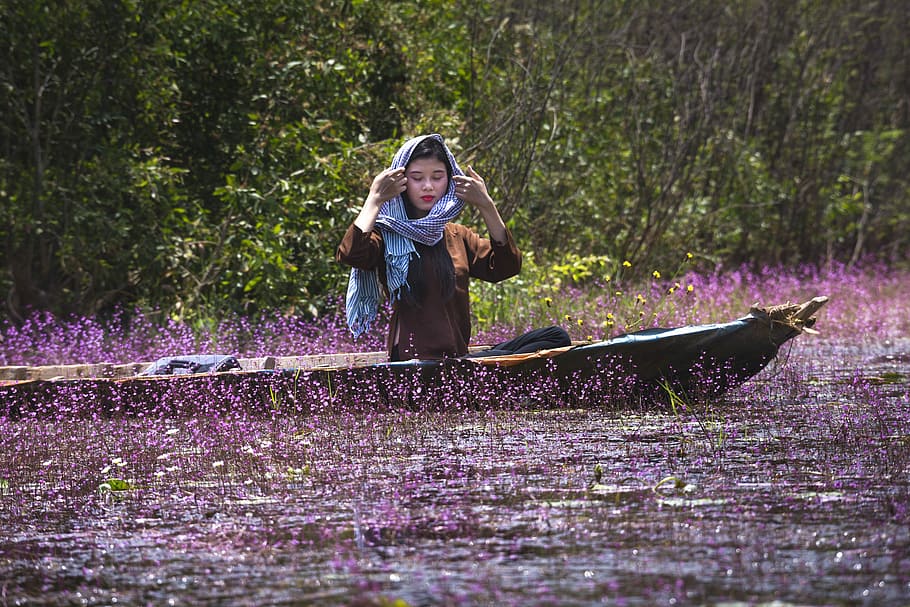 woman riding boat near purple petaled flowers, united, turkish, HD wallpaper