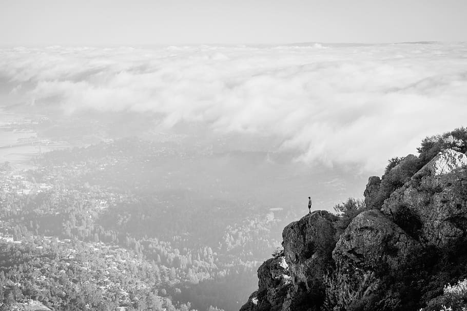 person standing at top of cliff, nature, mountain, clouds, rocks HD wallpaper