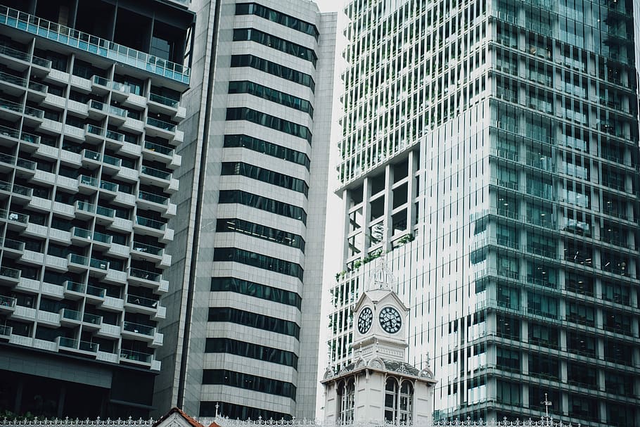 low angle photography of concrete building, person showing white concrete building HD wallpaper