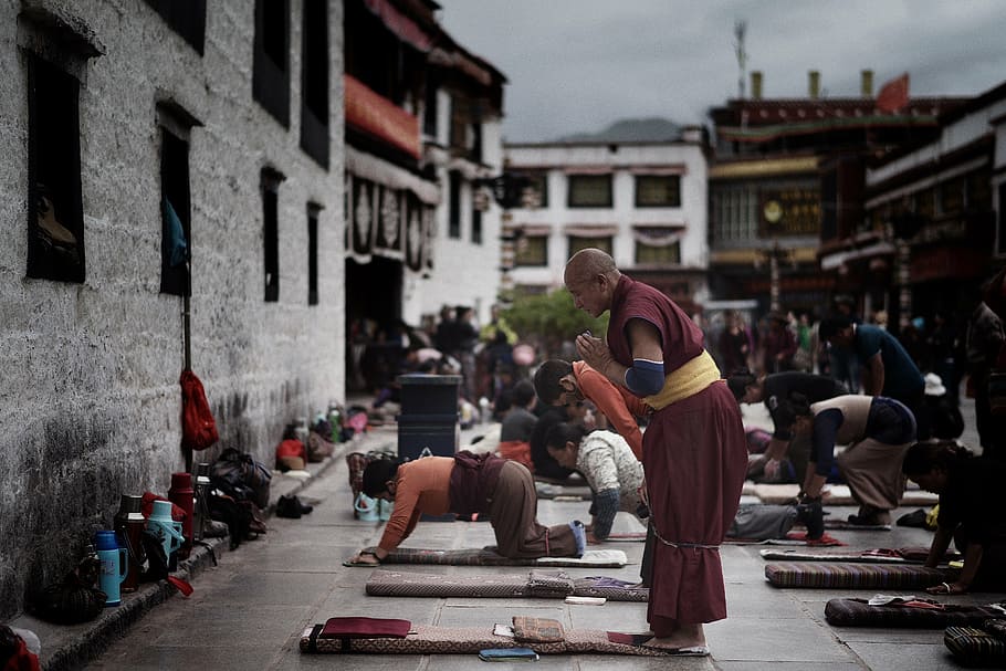group of people praying outside the building, tibet, jokhang