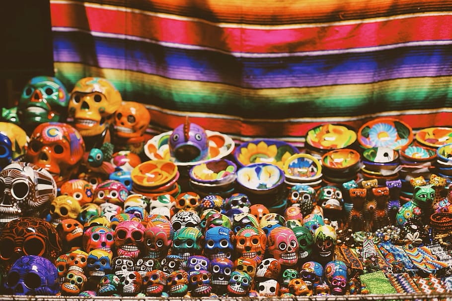 photo of assorted-color calavera figurines, skull, decors, skulls