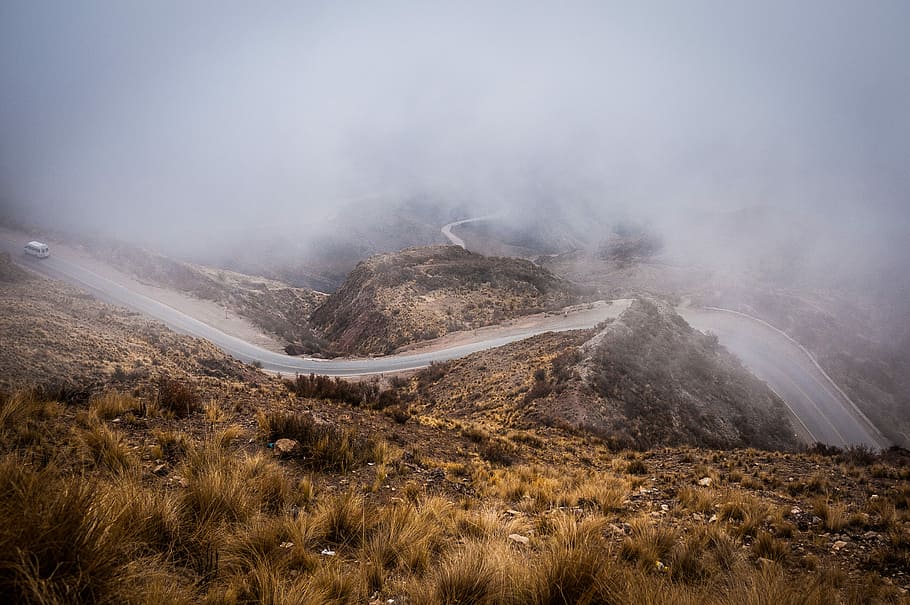 road covered in sea of clouds, fogging winding road, hill, mist HD wallpaper