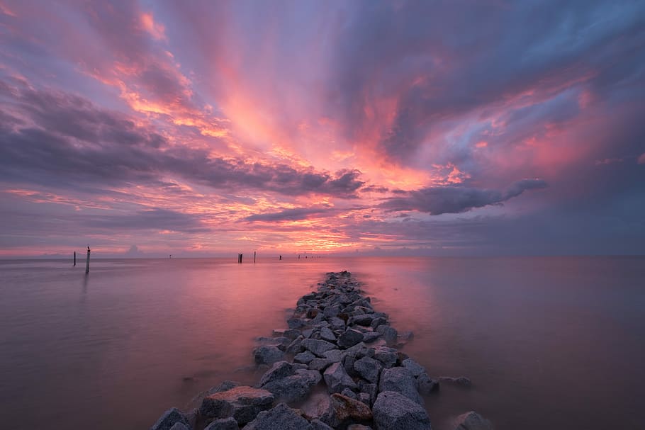 stones on body of water, sunset over the horizon, sky, twilight HD wallpaper
