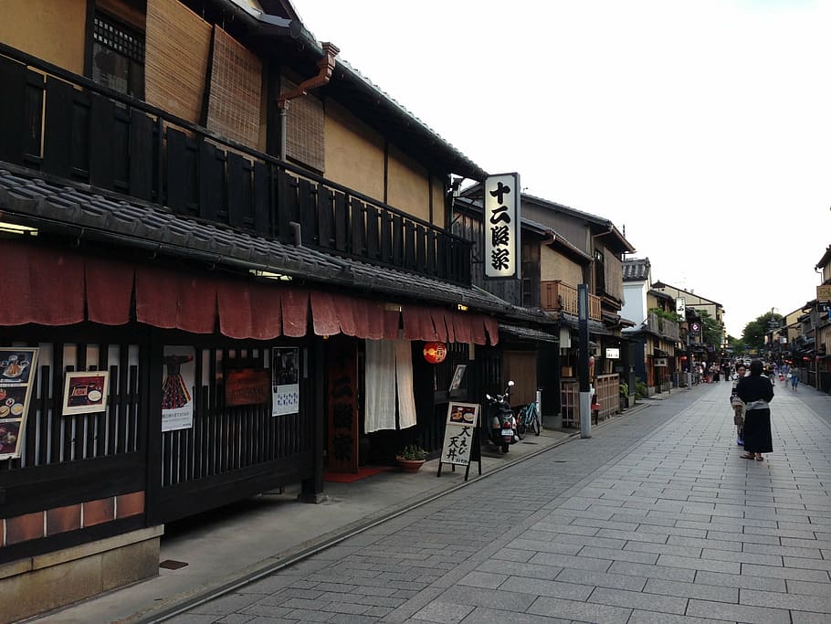 group of people walking beside restaurant, kyoto, japan, japanese style