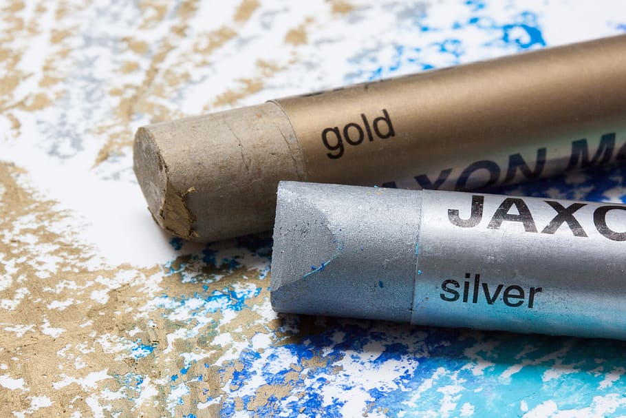 close-up photo of gold and silver colors, pastels, oil pastels