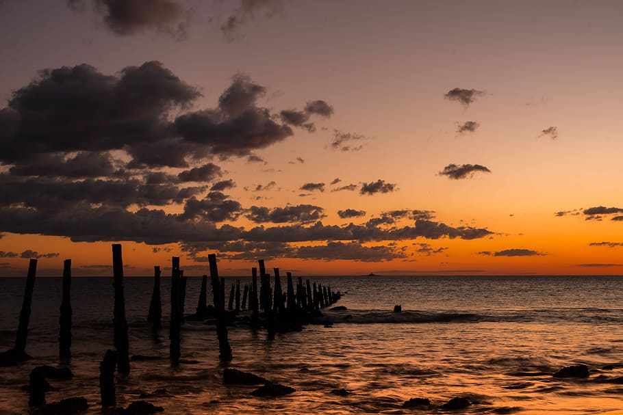 brown wooden dock near body of water during sunset, body of water at golden hour HD wallpaper