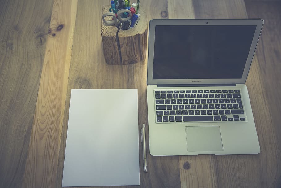 fly lay photography of MacBook Air and white printer paper HD wallpaper