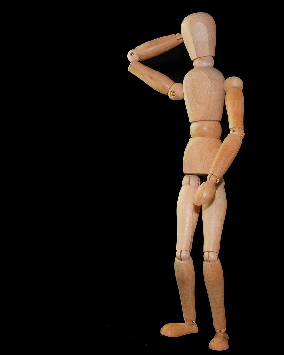 brown wooden manekin, figure, stand, headaches, thinking, doll