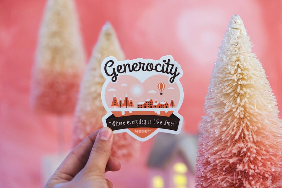 Generocity sticker, person holding heart with generocity-printed card HD wallpaper
